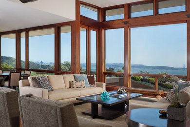 Large contemporary formal open plan living room in San Francisco with beige walls, medium hardwood flooring, no fireplace and no tv.