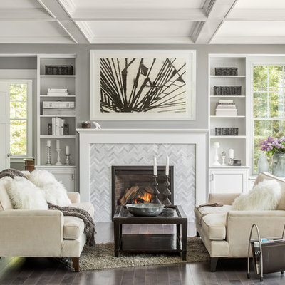 Example of a transitional formal dark wood floor living room design in Portland Maine with gray walls, a standard fireplace and no tv