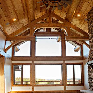 Timber frame great room with large windows