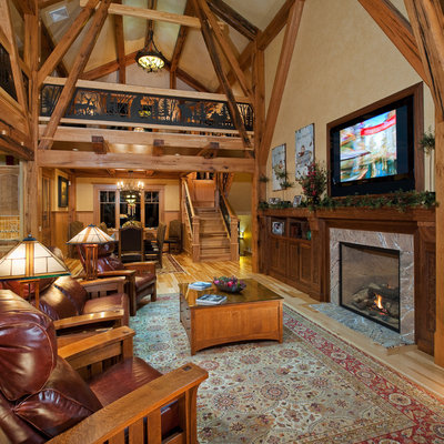Living room - rustic living room idea in New York with beige walls and a standard fireplace