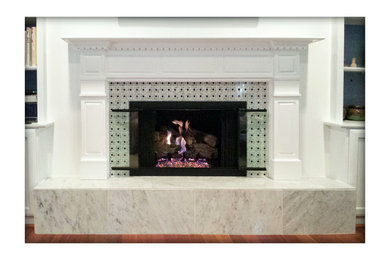 Inspiration for a timeless brown floor living room remodel in Atlanta with a standard fireplace and a tile fireplace