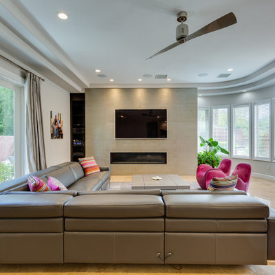 Inspiration for a contemporary beige floor living room remodel in Las Vegas with white walls, a ribbon fireplace and a wall-mounted tv