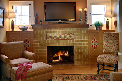 Example of an eclectic living room design in New York with a tile fireplace