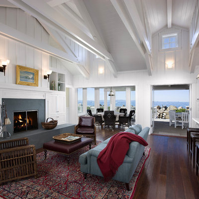 Inspiration for a large coastal open concept and formal dark wood floor living room remodel in Santa Barbara with white walls, a standard fireplace, a concrete fireplace and no tv