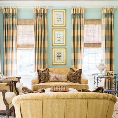 Example of a classic formal living room design in New York with green walls