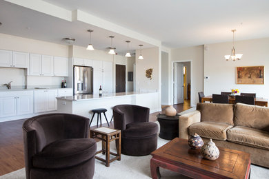 Example of a mid-sized classic formal and open concept dark wood floor and brown floor living room design in Other with beige walls, no fireplace and no tv