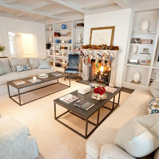 Huge elegant living room library photo in Houston with a standard fireplace