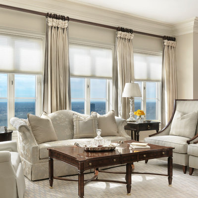 Elegant open concept living room photo in Other with beige walls