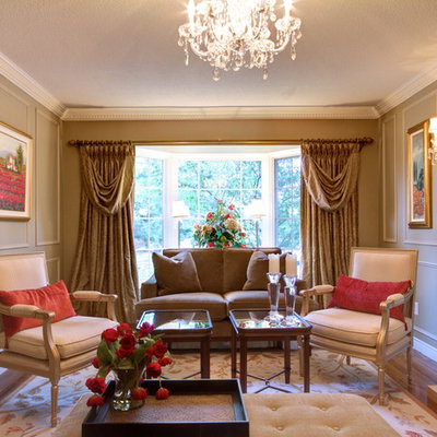 Inspiration for a timeless enclosed living room remodel in Toronto with beige walls and a standard fireplace