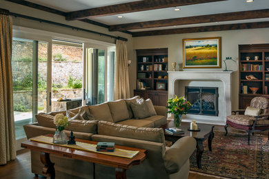 Inspiration for a large timeless formal and open concept medium tone wood floor living room remodel in San Francisco with beige walls, a stone fireplace, a standard fireplace and no tv