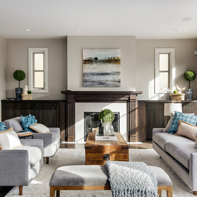 Example of a mid-sized classic open concept and formal medium tone wood floor living room design in Calgary with beige walls, a standard fireplace, a tile fireplace and no tv