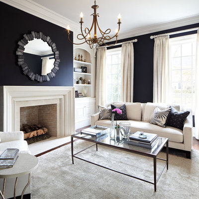 Living room - traditional formal and enclosed living room idea in Dallas with black walls, a standard fireplace and no tv