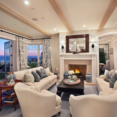 Inspiration for a timeless enclosed living room remodel in Orange County with a standard fireplace