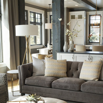 Living room - mid-sized transitional open concept medium tone wood floor and brown floor living room idea in Other with beige walls, a standard fireplace, a tile fireplace and a wall-mounted tv