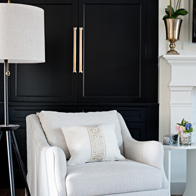 Example of a mid-sized transitional formal and enclosed medium tone wood floor living room design in Toronto with white walls, a standard fireplace, a stone fireplace and a wall-mounted tv