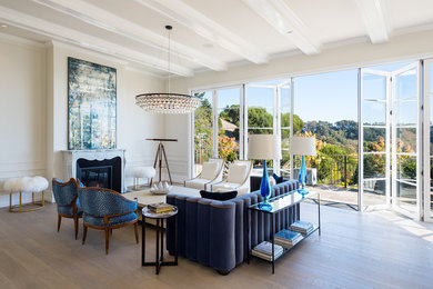 This is an example of a large traditional formal open plan living room in San Francisco with medium hardwood flooring, a standard fireplace, a stone fireplace surround, beige walls and brown floors.