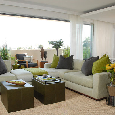 Example of a transitional open concept living room design in Los Angeles with white walls