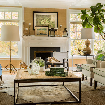 Example of a transitional formal living room design in Boston with beige walls and a standard fireplace