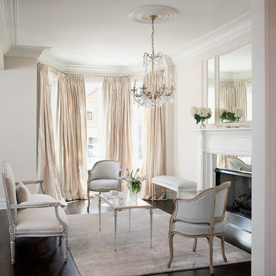 Example of a transitional formal and enclosed dark wood floor living room design in Chicago with white walls, a standard fireplace, a metal fireplace and no tv