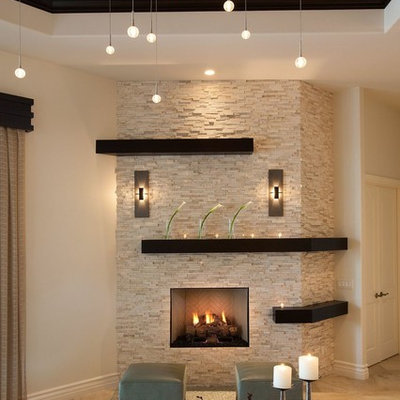 Living room - mid-sized transitional open concept limestone floor living room idea in Miami with beige walls, a standard fireplace and a stone fireplace