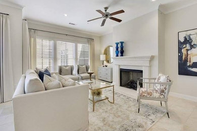 This is an example of a medium sized classic formal open plan living room in New Orleans with a standard fireplace, a stone fireplace surround, beige walls and ceramic flooring.