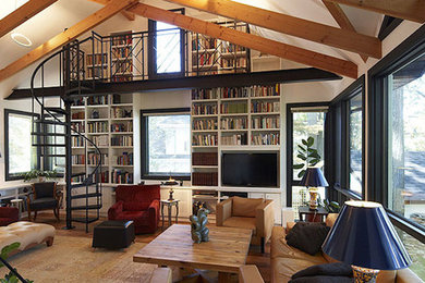 Example of a mid-sized transitional light wood floor living room library design in Toronto with white walls