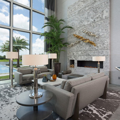 Large trendy formal porcelain tile and gray floor living room photo in Miami with gray walls and a ribbon fireplace