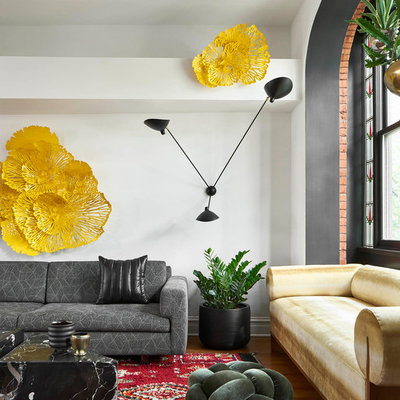 Example of a mid-sized eclectic open concept medium tone wood floor and brown floor living room design in Chicago with white walls
