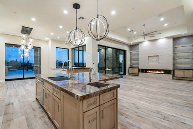 Large open plan living room in Phoenix with a home bar, ceramic flooring, a concrete fireplace surround, a built-in media unit and a vaulted ceiling.