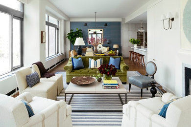Living room - large transitional open concept living room idea in New York with white walls and a media wall