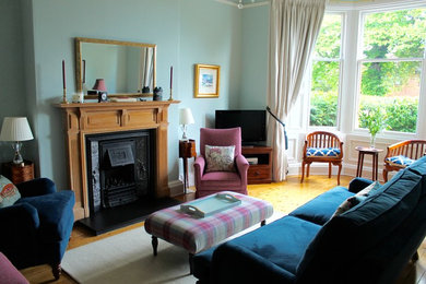 This is an example of a medium sized traditional living room in Edinburgh.