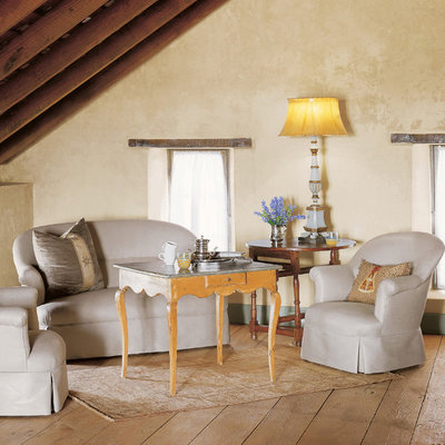 Inspiration for a cottage medium tone wood floor living room remodel in Austin with beige walls