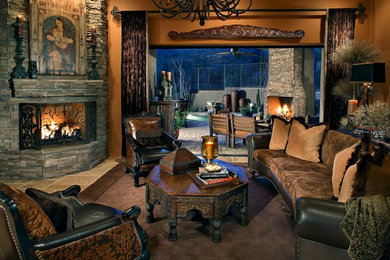 Living room - large mediterranean open concept and formal travertine floor and beige floor living room idea in Phoenix with a corner fireplace, a stone fireplace, brown walls and no tv