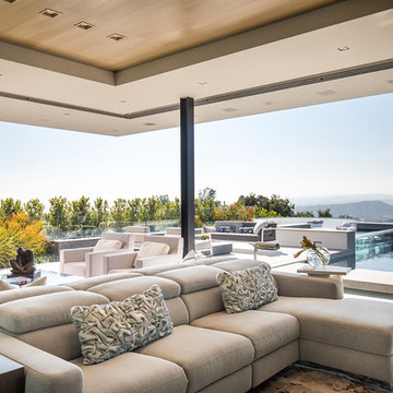 Trousdale Beverly Hills luxury home open air living room with sliding glass wall