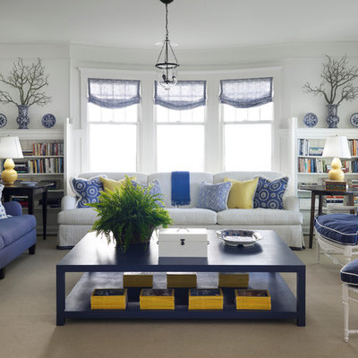 Example of a beach style carpeted living room design in Chicago with white walls