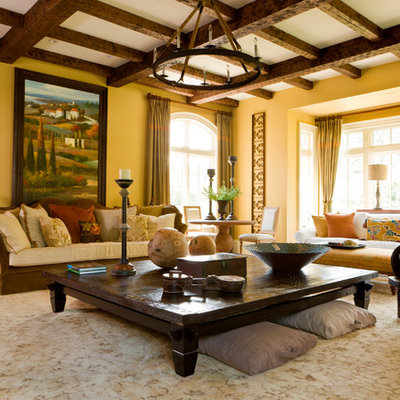 Example of a large tuscan formal and enclosed dark wood floor and brown floor living room design in DC Metro with yellow walls, no fireplace and no tv