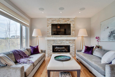 Example of a transitional living room design in Calgary
