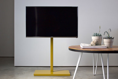Exempel på ett modernt vardagsrum, med en fristående TV