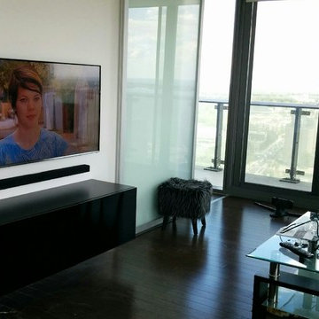 TV wall mounted with Floating Media shelve and Soundbar