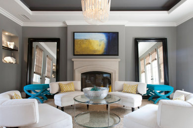Transitional formal living room photo in Orange County with gray walls, a standard fireplace and a stone fireplace