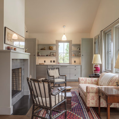 Inspiration for a country formal medium tone wood floor living room remodel in San Francisco with white walls, a standard fireplace and a stone fireplace