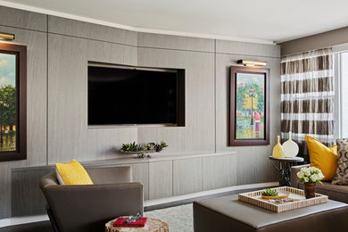 Example of a minimalist open concept dark wood floor living room design in New York with a music area, gray walls and a media wall