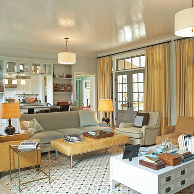 Example of a transitional living room design in New York with blue walls