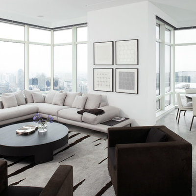 Large trendy living room photo in New York with white walls