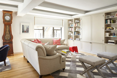 Living room - mid-sized transitional open concept light wood floor living room idea in New York with white walls and a media wall