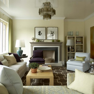 Inspiration for a transitional formal and enclosed living room remodel in New York with yellow walls, a standard fireplace and no tv
