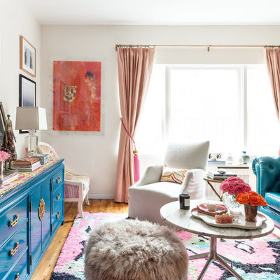 Living room - eclectic medium tone wood floor living room idea in New York with white walls and no fireplace
