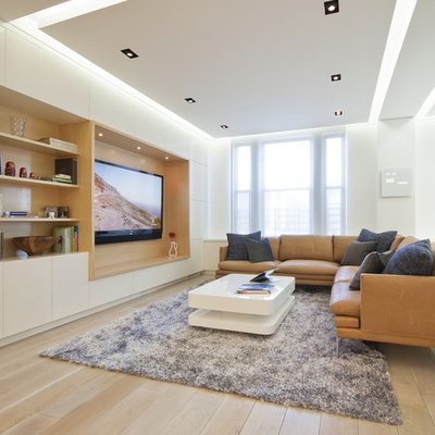 Living room - modern living room idea in New York with no fireplace and a media wall