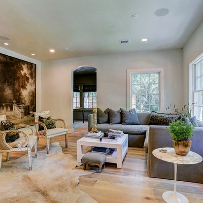 Cottage open concept light wood floor living room photo in Houston