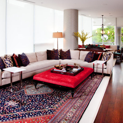 Inspiration for an eclectic open concept red floor living room remodel in Chicago with a bar